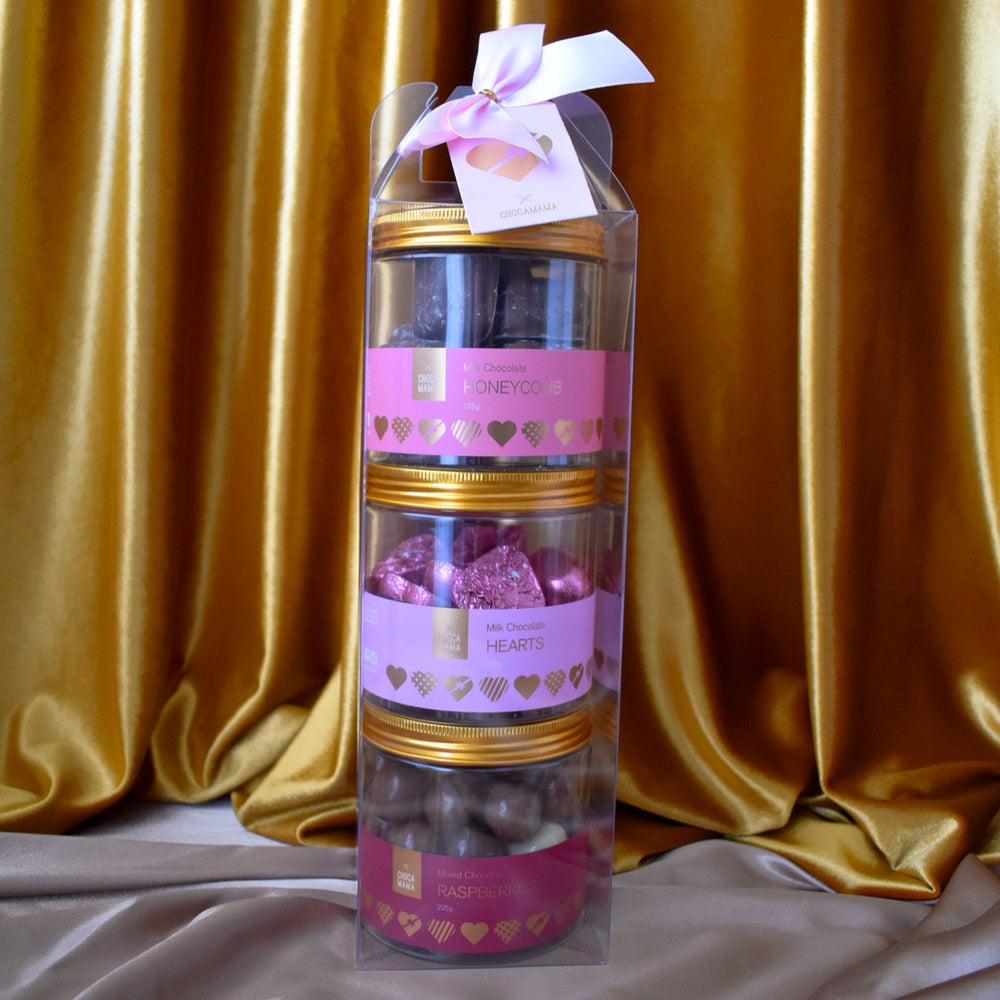 A three tier tower chocolate and confectionery gift pack from Chocamama with a pink ribbon.