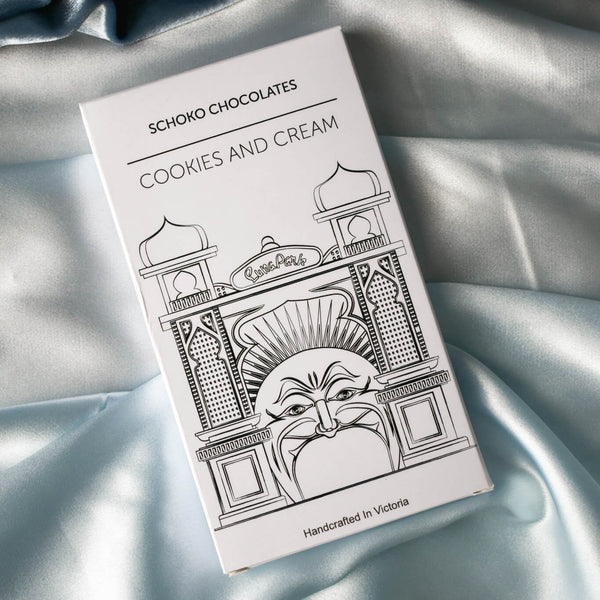 Block of Cookies and Cream flavoured chocolate from Schoko Chocolates in white packaging with a black line drawing.